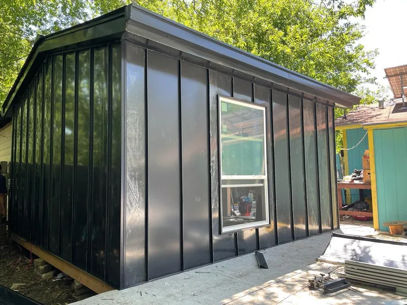 Black standing seam metal wall panels for Roof Inspection in Glendora