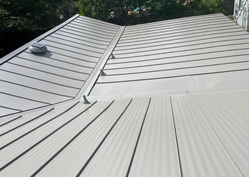 Solar attic fan installed on a metal roof for Roof Ventilation in Glendora